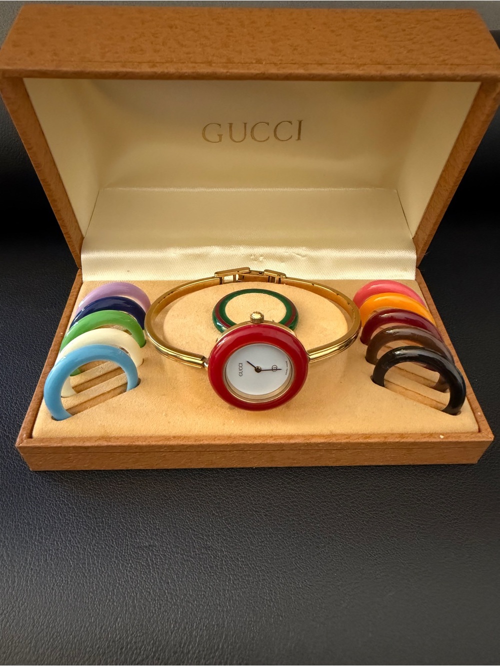 Gucci Gold Bangle Watch with Red Bezel and Interchangeable Color Bezels